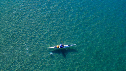 High angle view of man kayaking in sea