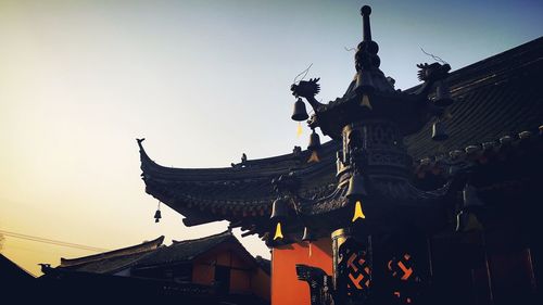 Low angle view of statue against sky