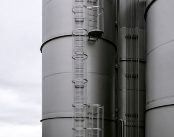 Low angle view of smoke stack against sky