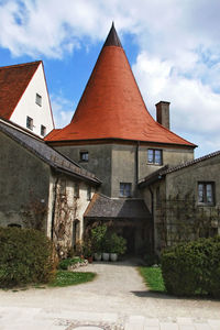 View of old building against cloudy sky