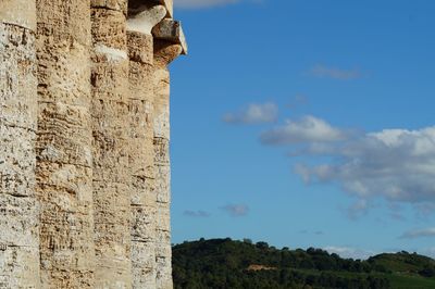 Low angle view of old ruin building against sky