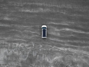 Low angle view of telephone booth against sea