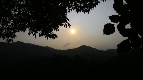 Silhouette of mountain against sky during sunset