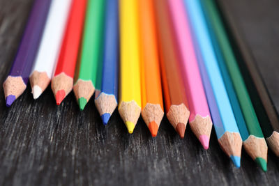 Close-up of colored pencils on table