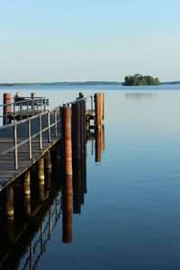 Pier over river against sky