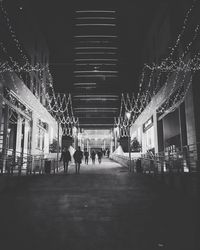 People in illuminated room