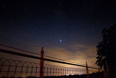 Low angle view of silhouette tree against sky at night