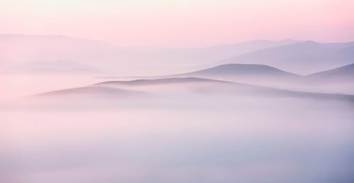 Scenic view of mountains against sky during sunset