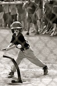 Full length of boy playing baseball