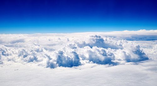 Scenic view of landscape against blue sky