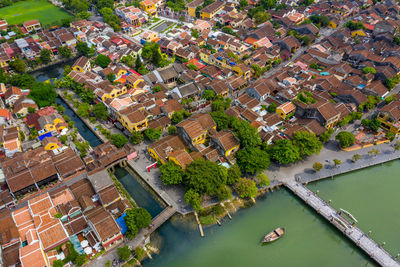 High angle view of river amidst buildings in city