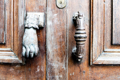 Close-up of old door with door knocker