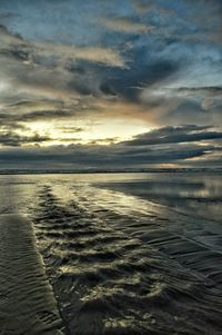 Scenic view of sea against cloudy sky