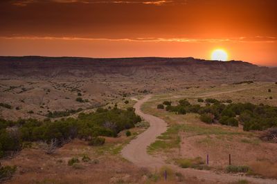 Scenic view of landscape against sky during sunset