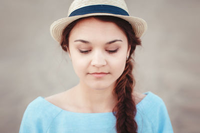 Close-up of smiling woman looking down