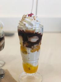 Close-up of ice cream in glass on table