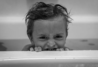 Portrait of cute boy in bathroom