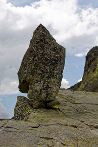 Low angle view of rock against sky