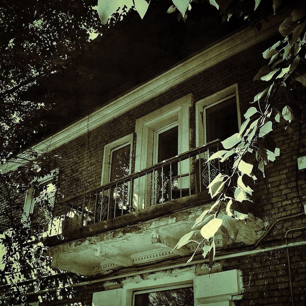 building exterior, architecture, built structure, window, house, residential building, residential structure, night, low angle view, building, outdoors, no people, balcony, roof, sunlight, tree, abandoned, old, city