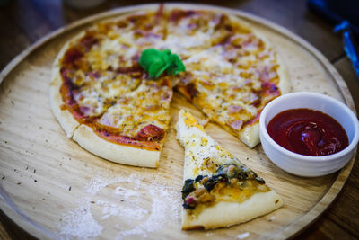 Close-up of pizza served on table