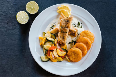 High angle view of fish served in plate on table