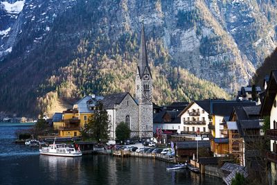 Panoramic view of lake and buildings against sky