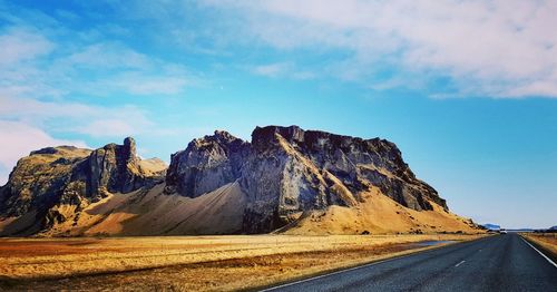 Scenic view of mountain road against sky