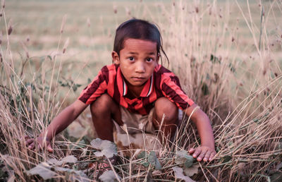 Portrait of smiling girl on field