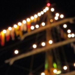 Defocused image of illuminated street lights at night