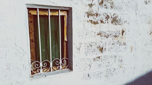 Closed window of house on sunny day