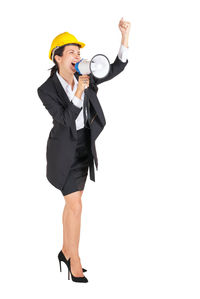 Full length of woman wearing hat against white background