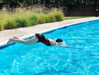 Woman swimming in pool