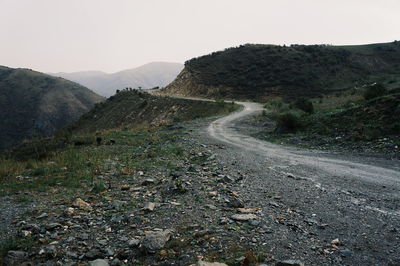 Road on mountain against sky