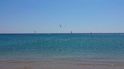 Scenic view of sea against clear blue sky