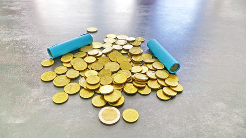 High angle view of coins on table