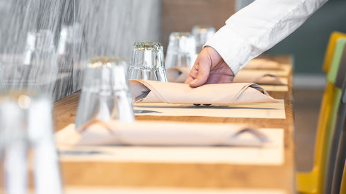 Close-up of a hand on table at restaurant