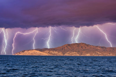 Lightning in sky over mountain