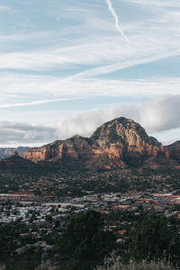 Scenic view of mountain against cloudy sky