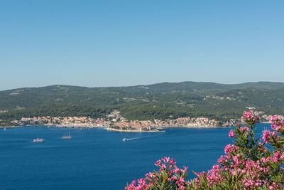 Scenic view of sea against clear blue sky