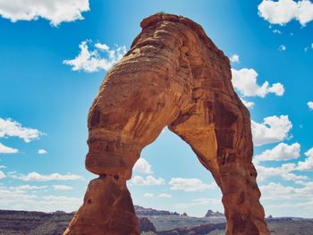 Low angle view of delicate arch against sky