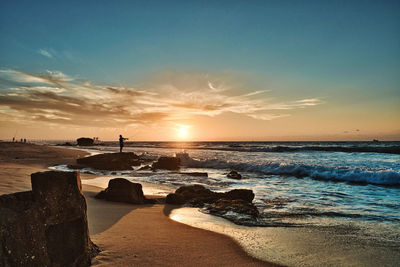 Scenic view of sea against sky during sunset