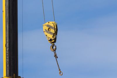 Low angle view of hanging against sky