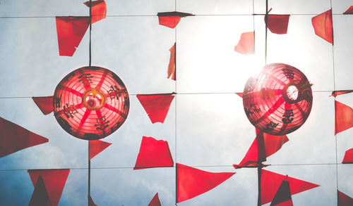 Directly below shot of chinese lanterns with decorations against sky