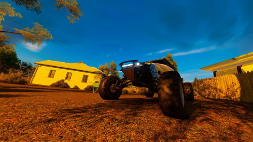 Motorcycle on road amidst field against sky