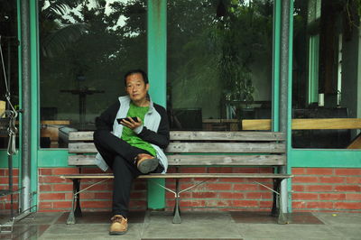 Portrait of young man using mobile phone
