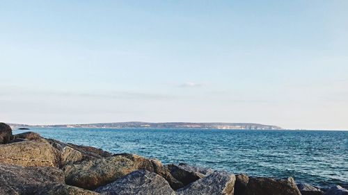 Scenic view of sea against blue sky