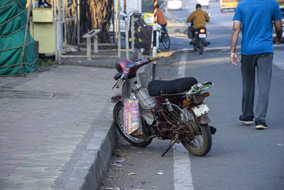 People riding motorcycle on road