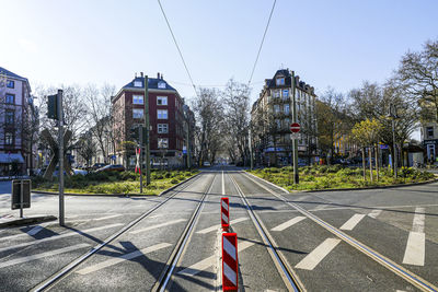 Road by city against sky