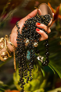 Close-up of woman hand holding butterfly