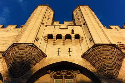 Low angle view of church against blue sky